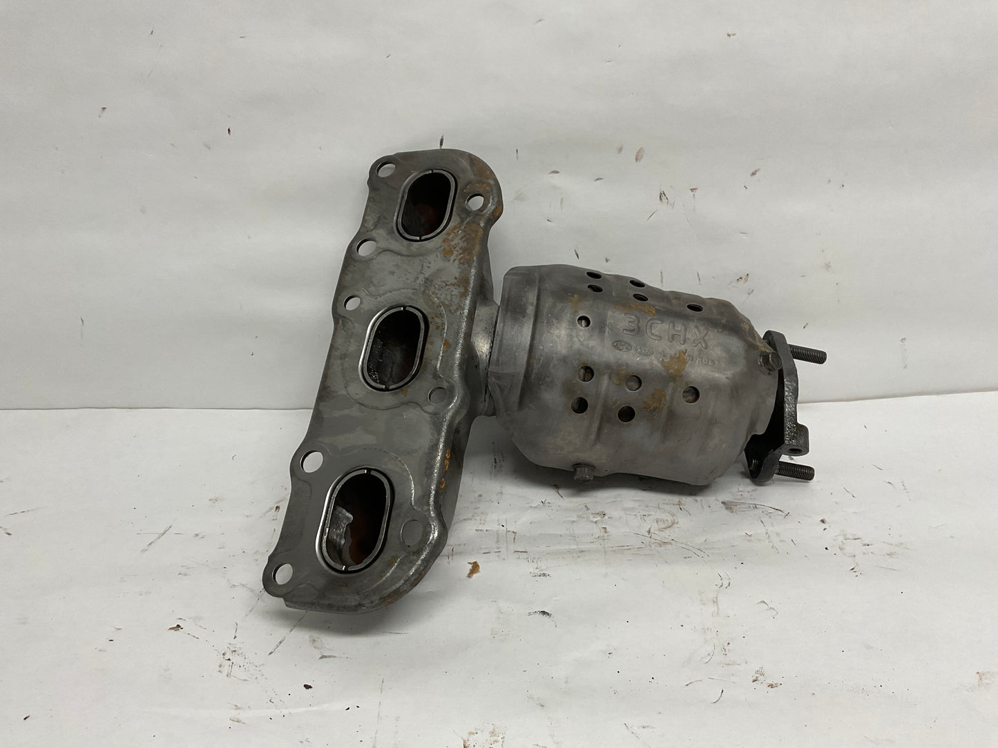 Right, Catalytic Converter with Integrated Exhaust Manifold