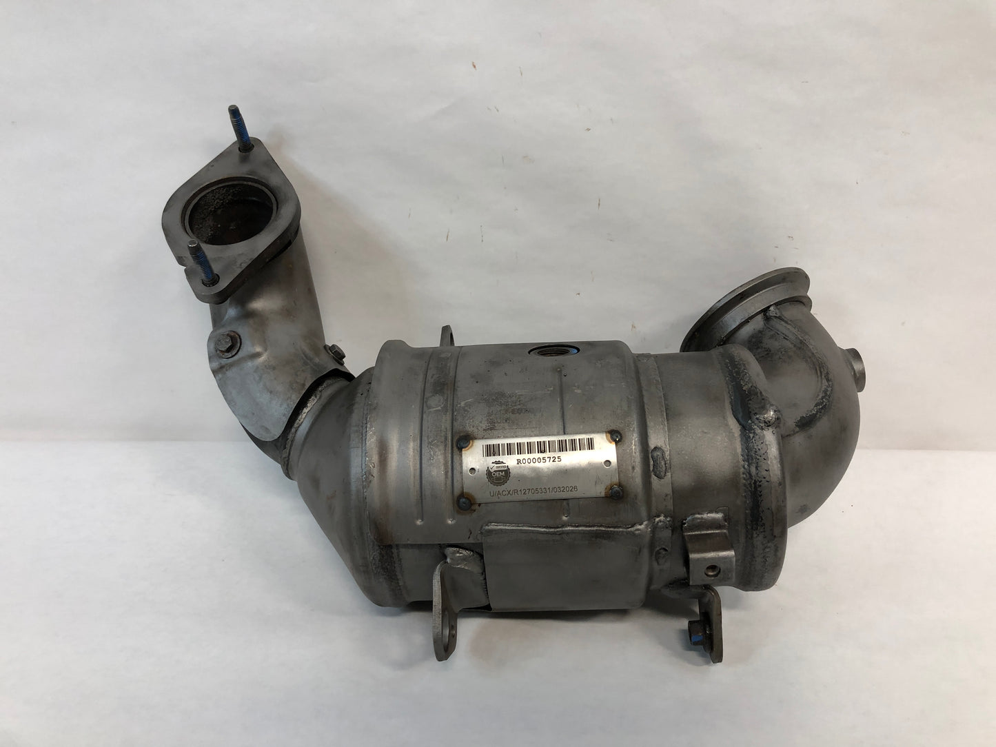 Catalytic Converter

Has factory dent on the exhaust side 2 stud flange