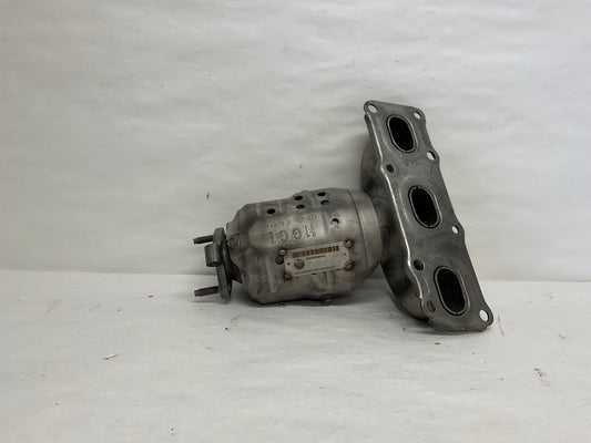 Left, Catalytic Converter with Integrated Exhaust Manifold

Mark on Heatshield typically "HGCI"
Can is straight and centered with middle of Manifold